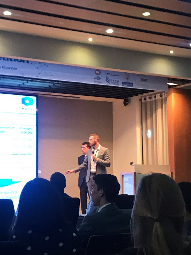 Presenting a business case on stage in South Korea