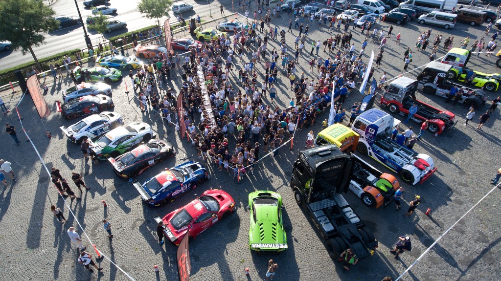 Aerial view of the truck racing fan zone with racing trucks and GT cars