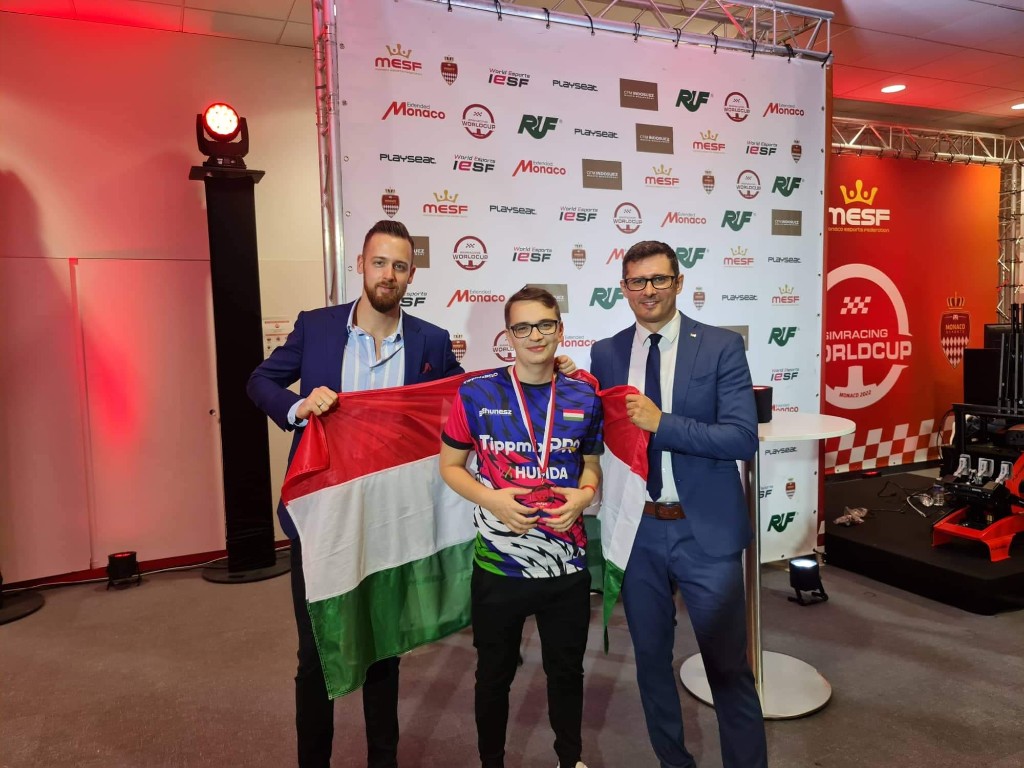 Hungarian sim-racing athlete with support team at Simracing Worldcup Monaco 2022