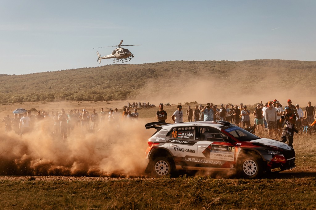 Škoda Fabia kicking up dust on a gravel Rally Hungary stage